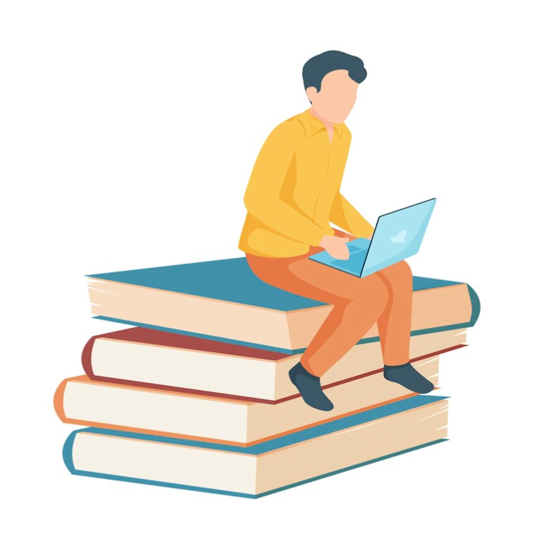 man with laptop sitting on books