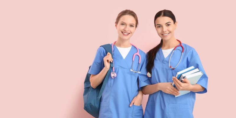 female medical students carrying books, bag and stethoscopes