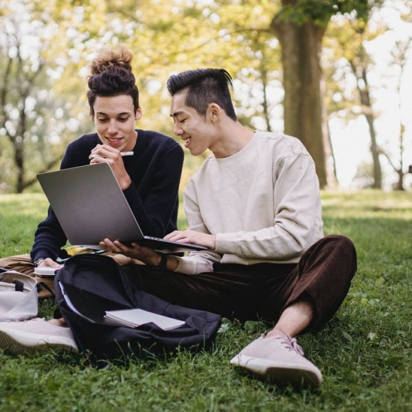 two college students looking for website to find scholarships