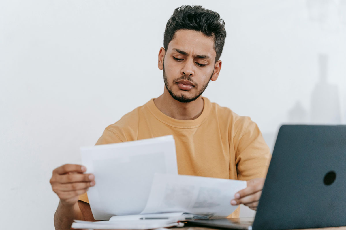 a man looking at papers