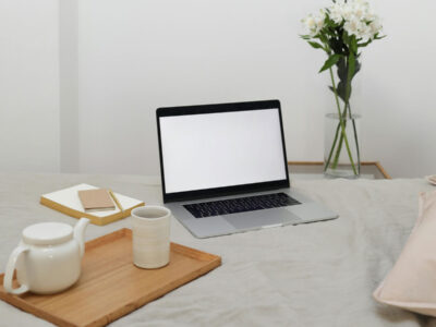 a laptop on a bed