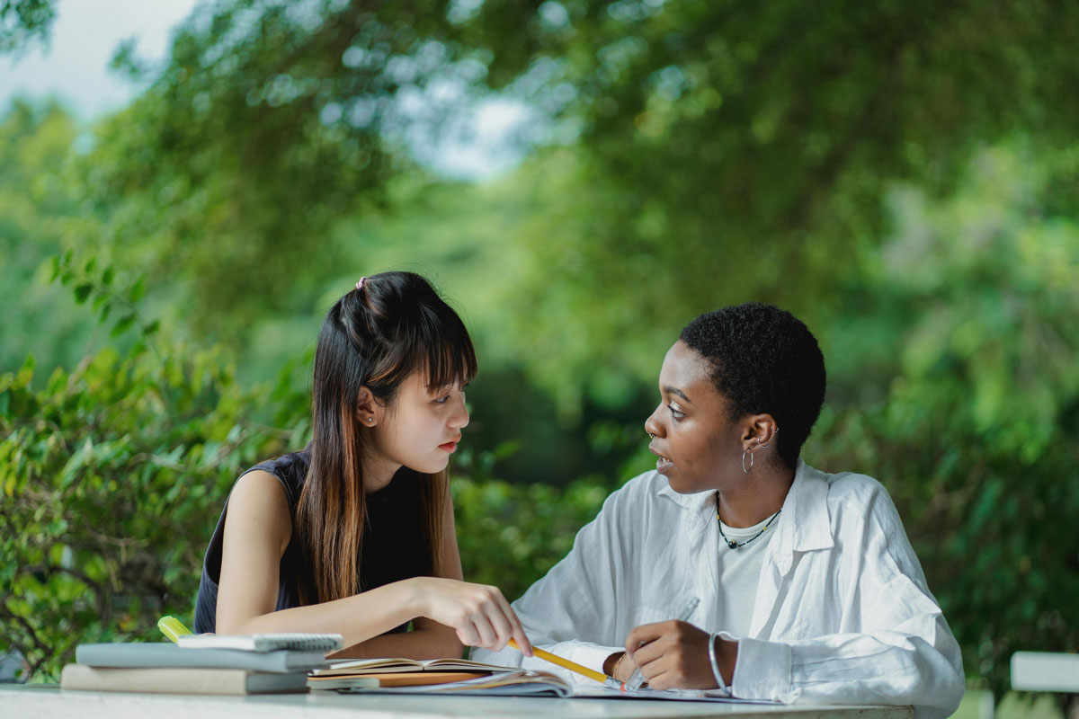 a woman looking at another woman