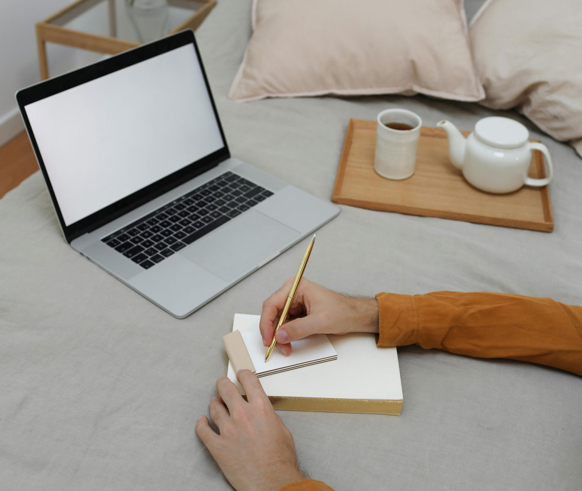 a person writing on a notebook