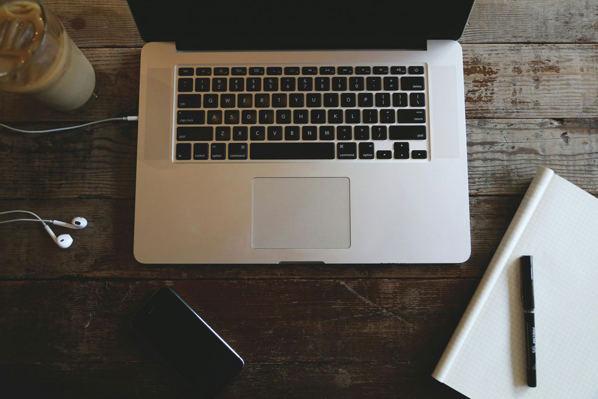 a laptop and a cellphone on a table