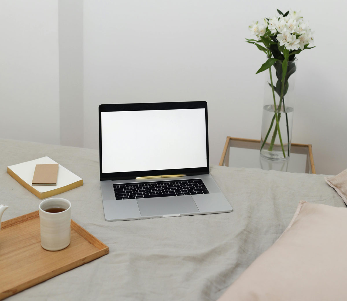a laptop on a bed